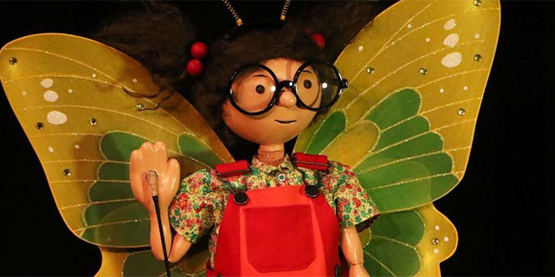 Girl puppet with glasses and butterfly wings at the Ballard Institute and Museum of Puppetry